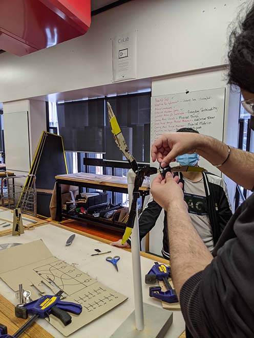 windmill constructed from PVC pipe and cardboard, using the arduino beginner kit motor