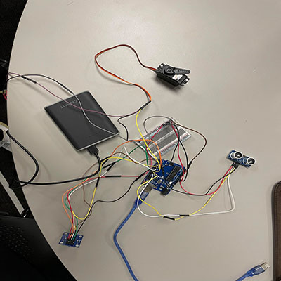 Arduino circuit with colour sensor, servo motor, and ultrasonic sensor