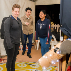 An exhibit guest with Jason and Tina